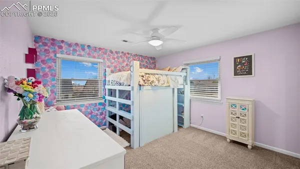 a room with furniture a chandelier and a window