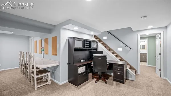 a dining room with furniture and entryway
