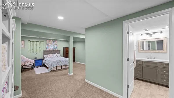a bedroom with a bed and a view of bathroom