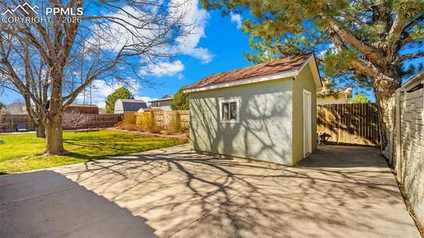 a view of a backyard of the house