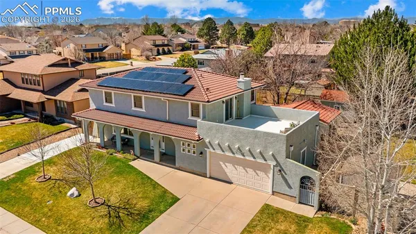 an aerial view of a house with swimming pool
