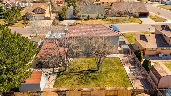 an aerial view of residential houses with outdoor space