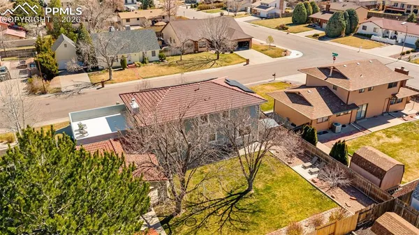 an aerial view of a house with swimming pool