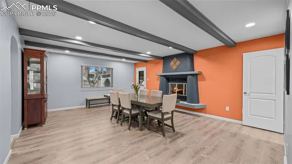 a dining room with furniture and window