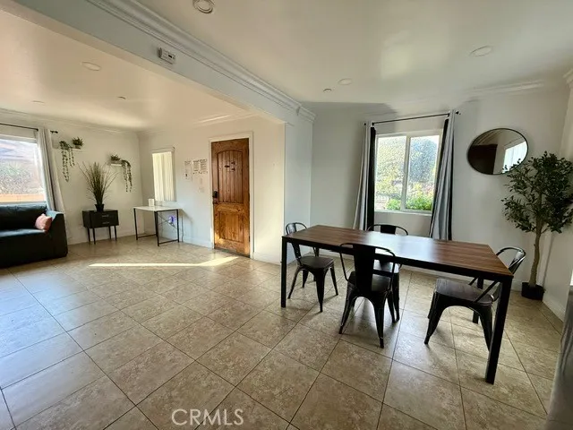 a view of a livingroom with furniture and a potted plant