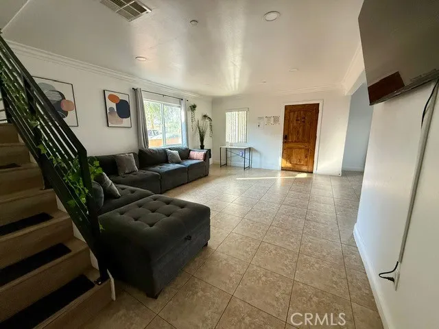 a living room with furniture and a window