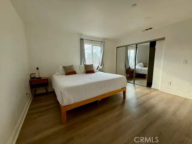 a bedroom with a bed and window