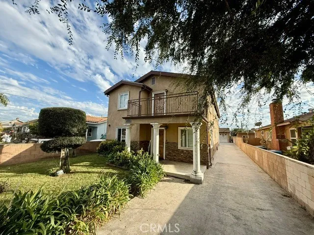 a view of house with yard entertaining space