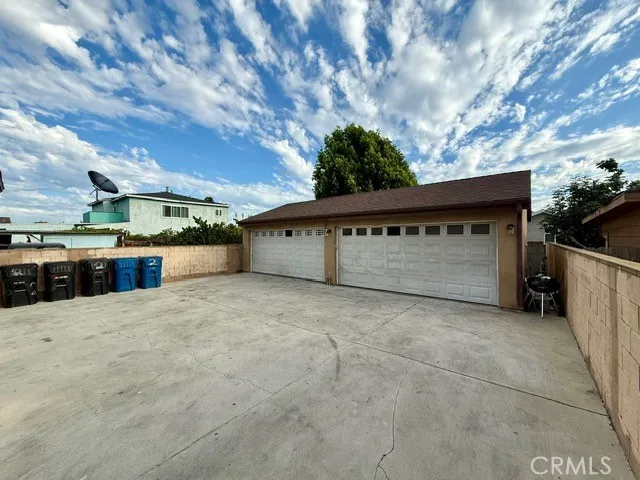a view of backyard with a large tree