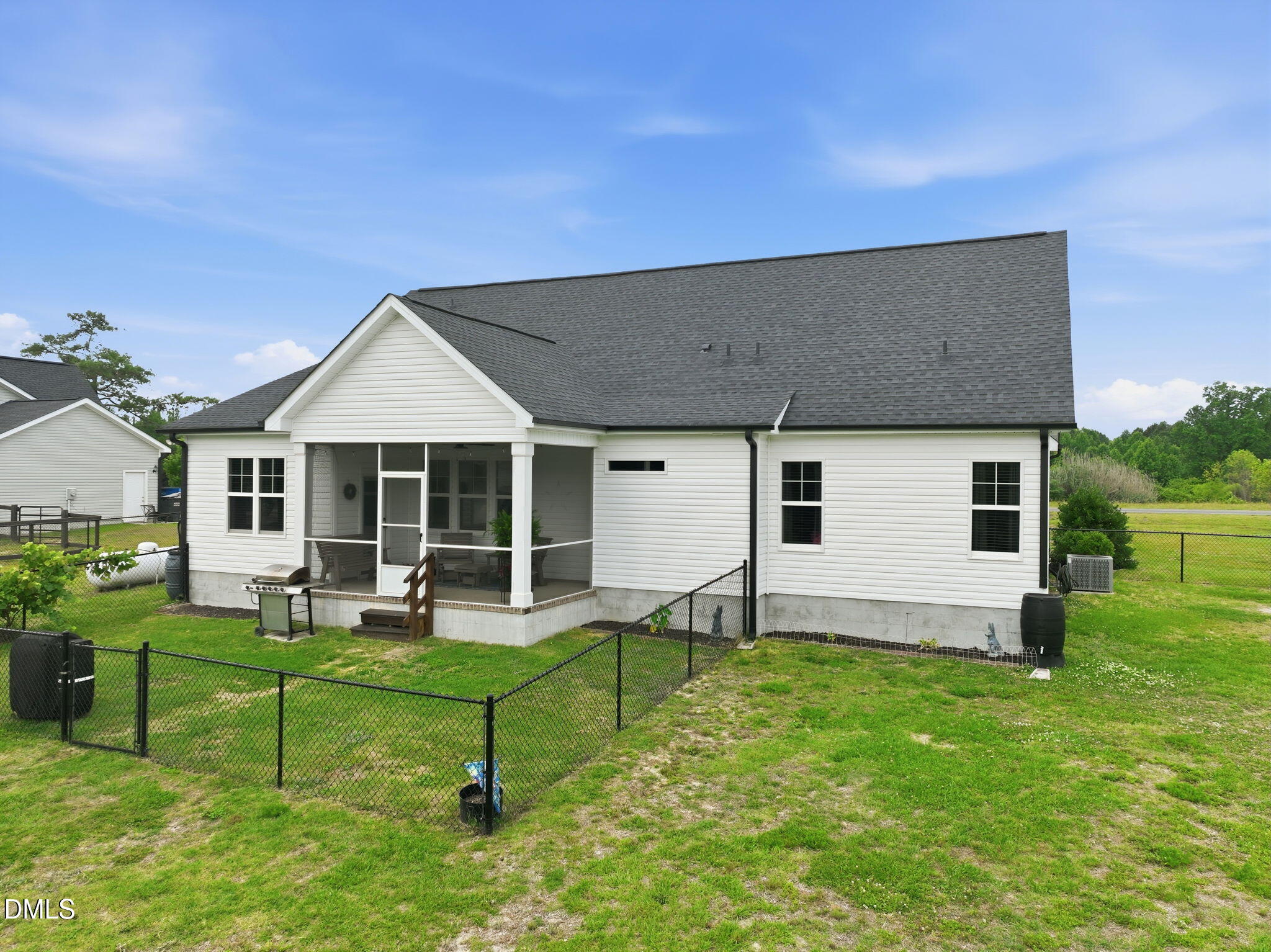 5098 Spring Hill Church Road Lillington, NC 27546 - Photo 32 of 36 a house view with a sitting space and garden