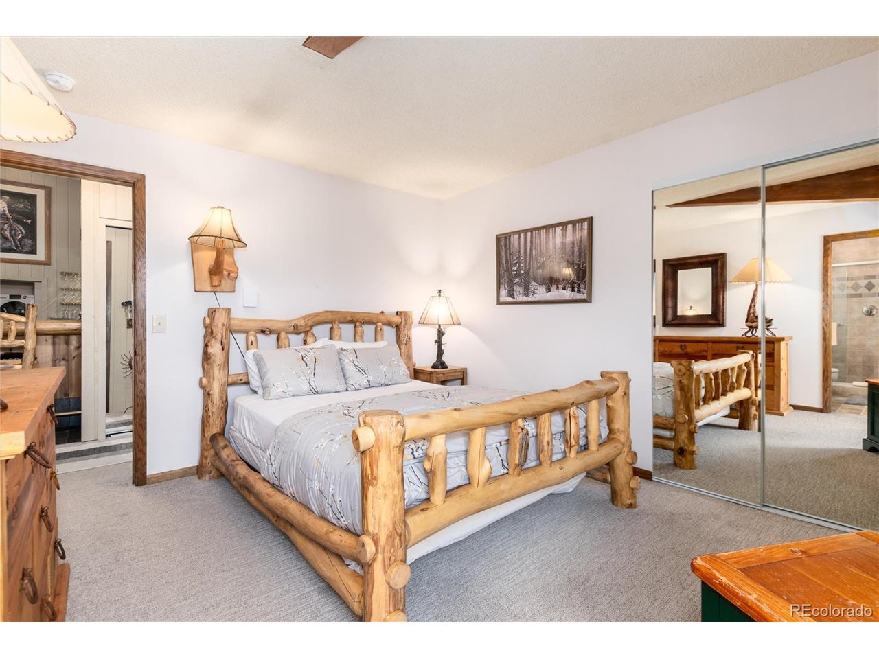 490 Kings Crossing Road, Unit 631 Winter Park, CO 80482 - Photo 30 of 43 a bedroom with a bed next to a window