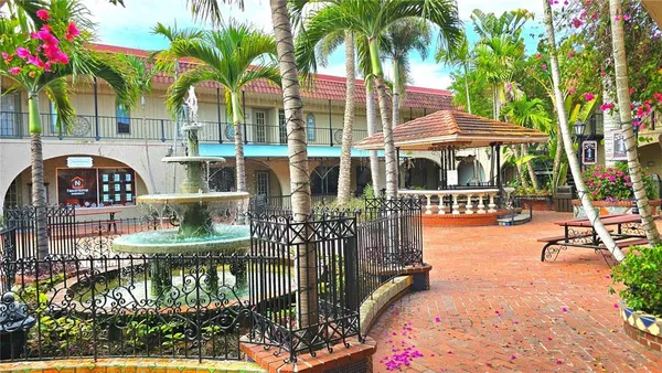 a view of swimming pool with a patio and a garden