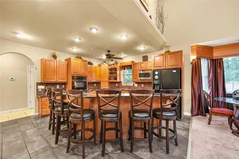 a view of a dining room with furniture and chandelier
