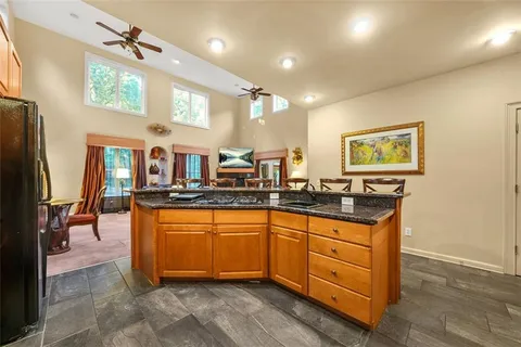 a view of a dining room with furniture and a chandelier