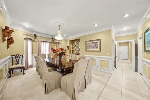 a living room with furniture fireplace and a large window