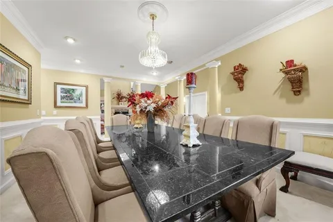 a living room with furniture large window and a fireplace