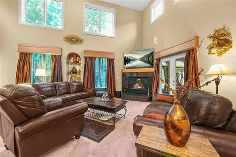 a room with furniture and a chandelier