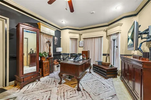 a bathroom with a granite countertop sink toilet and a mirror