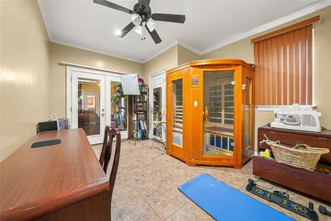 a view of a roof deck with table and chairs with wooden floor and fence