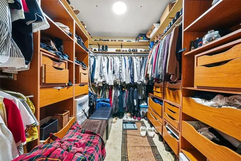 a roof deck with chairs and wooden floor