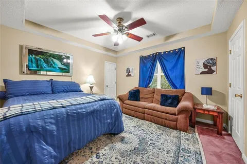 a balcony with wooden floor and yard in the back