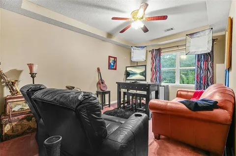 a view of a yard with plants and trees