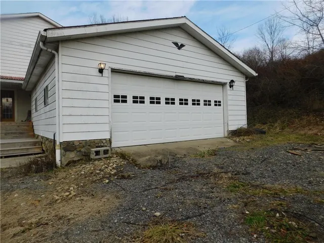 a view of a field of grass and trees