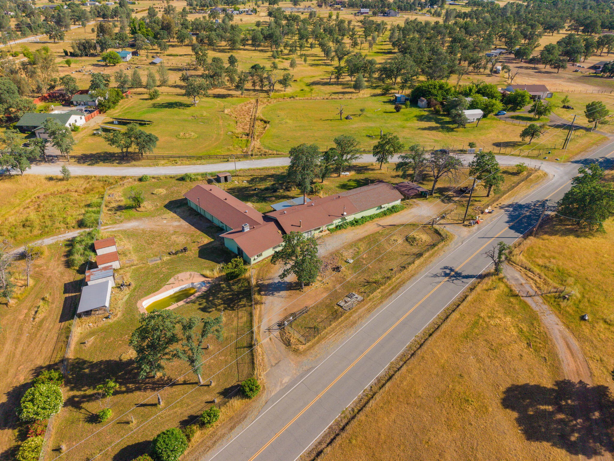 22189 Old Alturas Road Redding, CA 96003 - Photo 58 of 70 an aerial view of residential houses with outdoor space