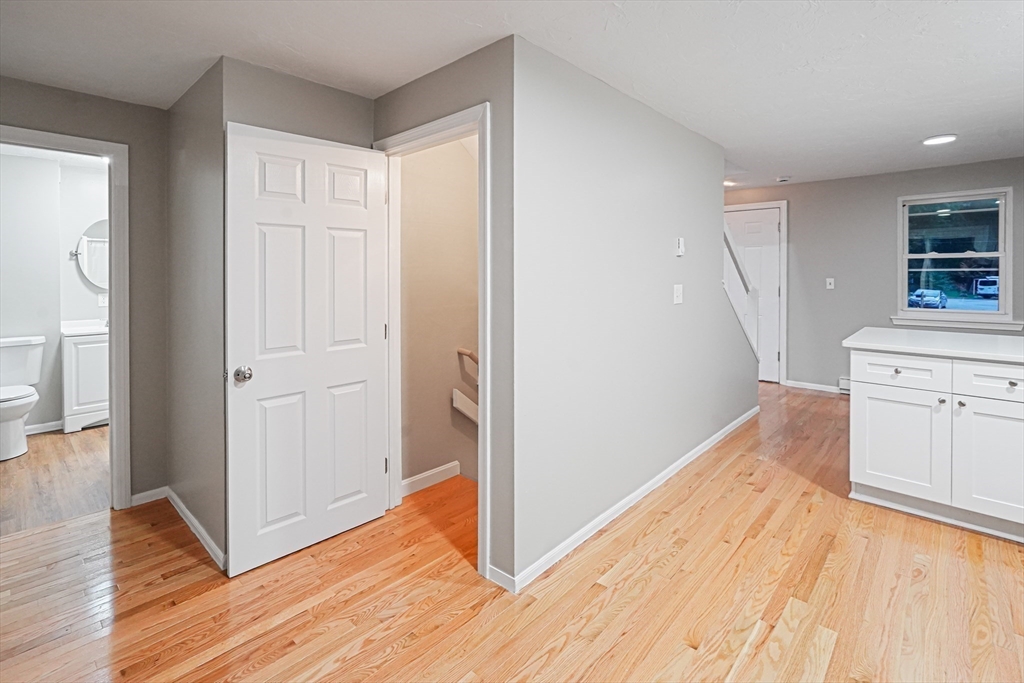 7 Debra Lane, Unit 1 Bellingham, MA 02019 - Photo 11 of 25 a view of a kitchen from the hallway