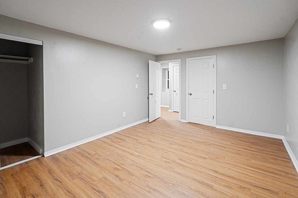 7 Debra Lane, Unit 1 Bellingham, MA 02019 - Photo 20 of 25 a view of empty room with wooden floor