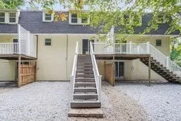 a view of a house with backyard and stairs