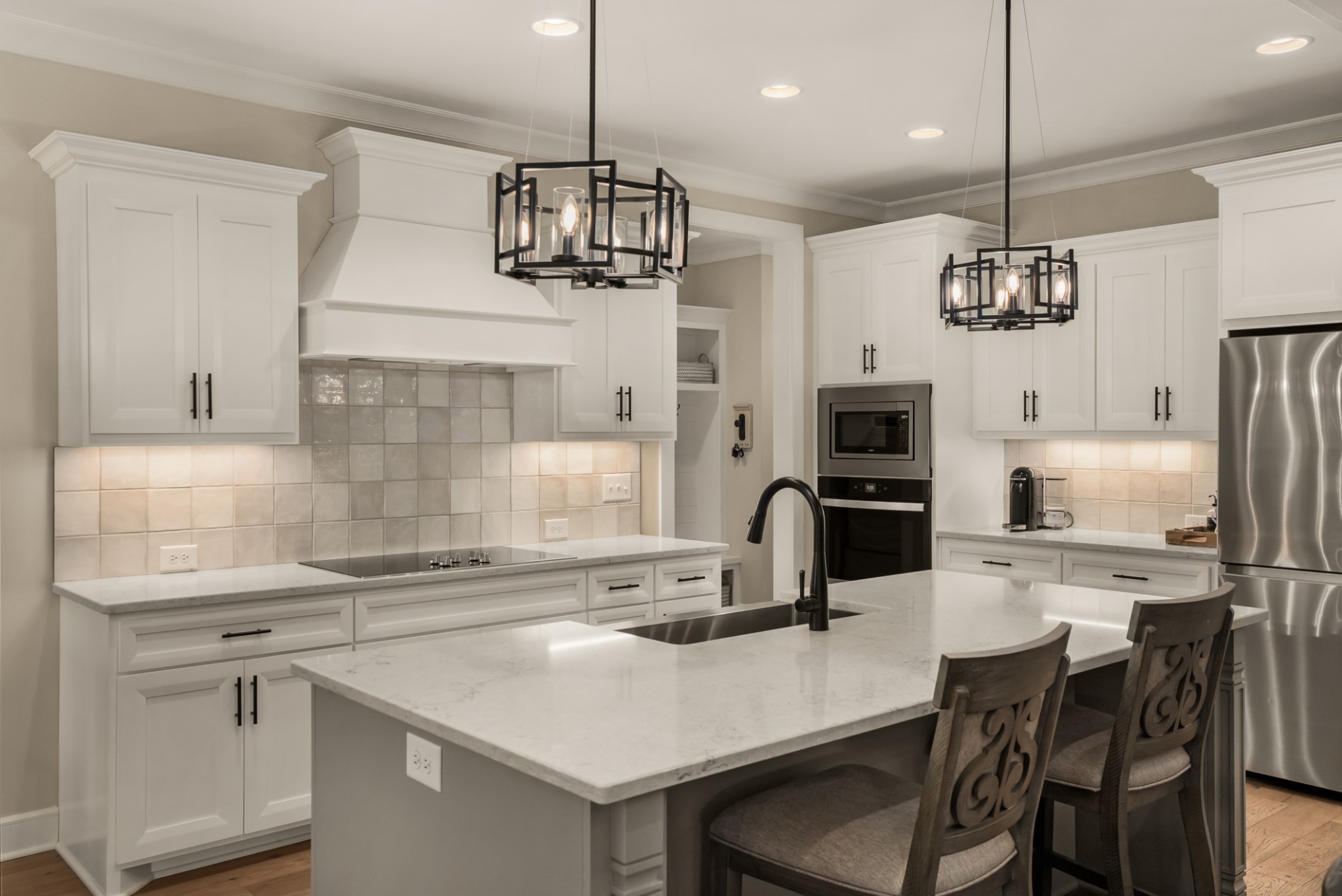 1497 Phillips Road Lebanon, TN 37087 - Photo 11 of 53 a kitchen with stainless steel appliances a kitchen island a stove a table and chairs in it
