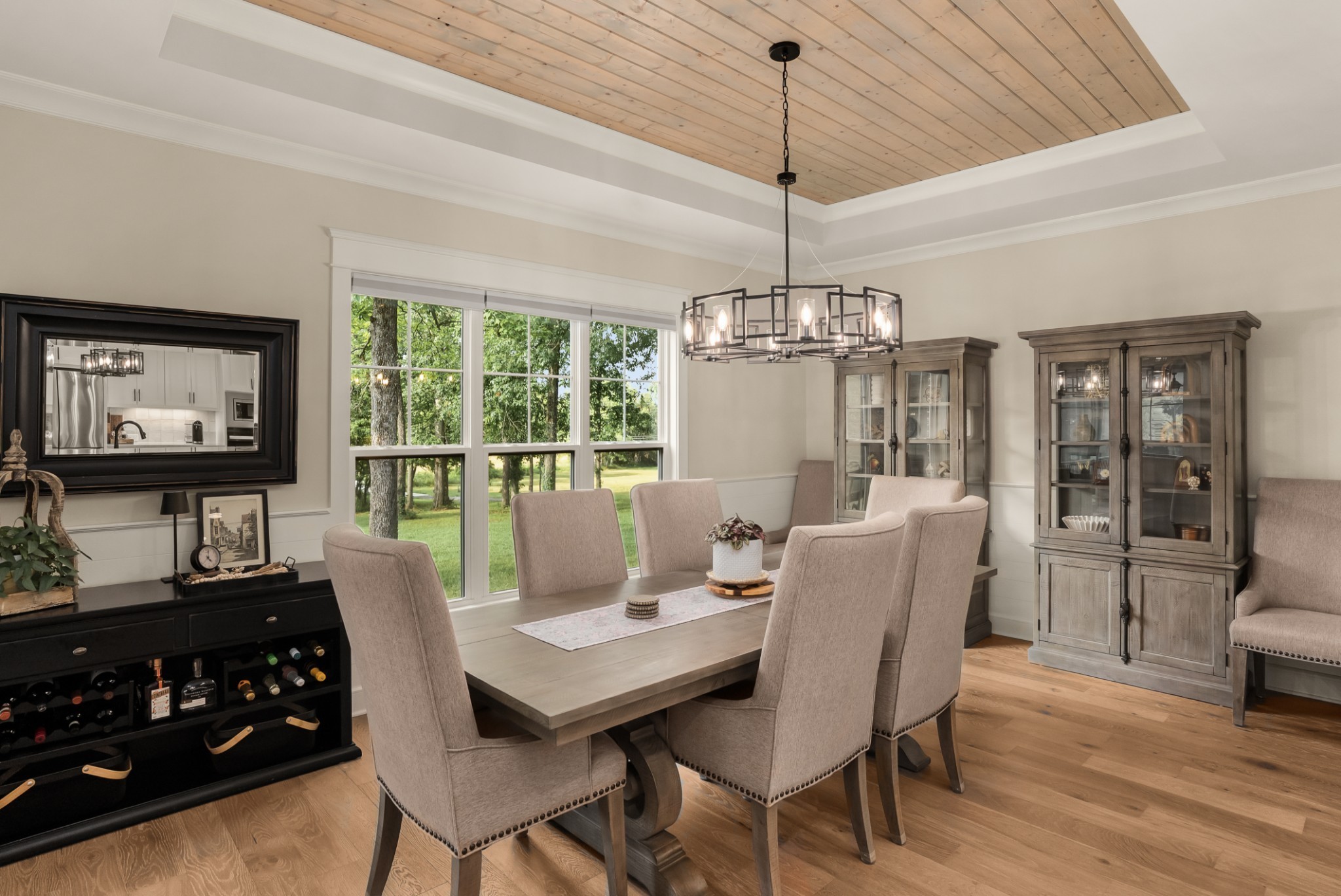 1497 Phillips Road Lebanon, TN 37087 - Photo 16 of 53 a dining room with furniture a chandelier and wooden floor