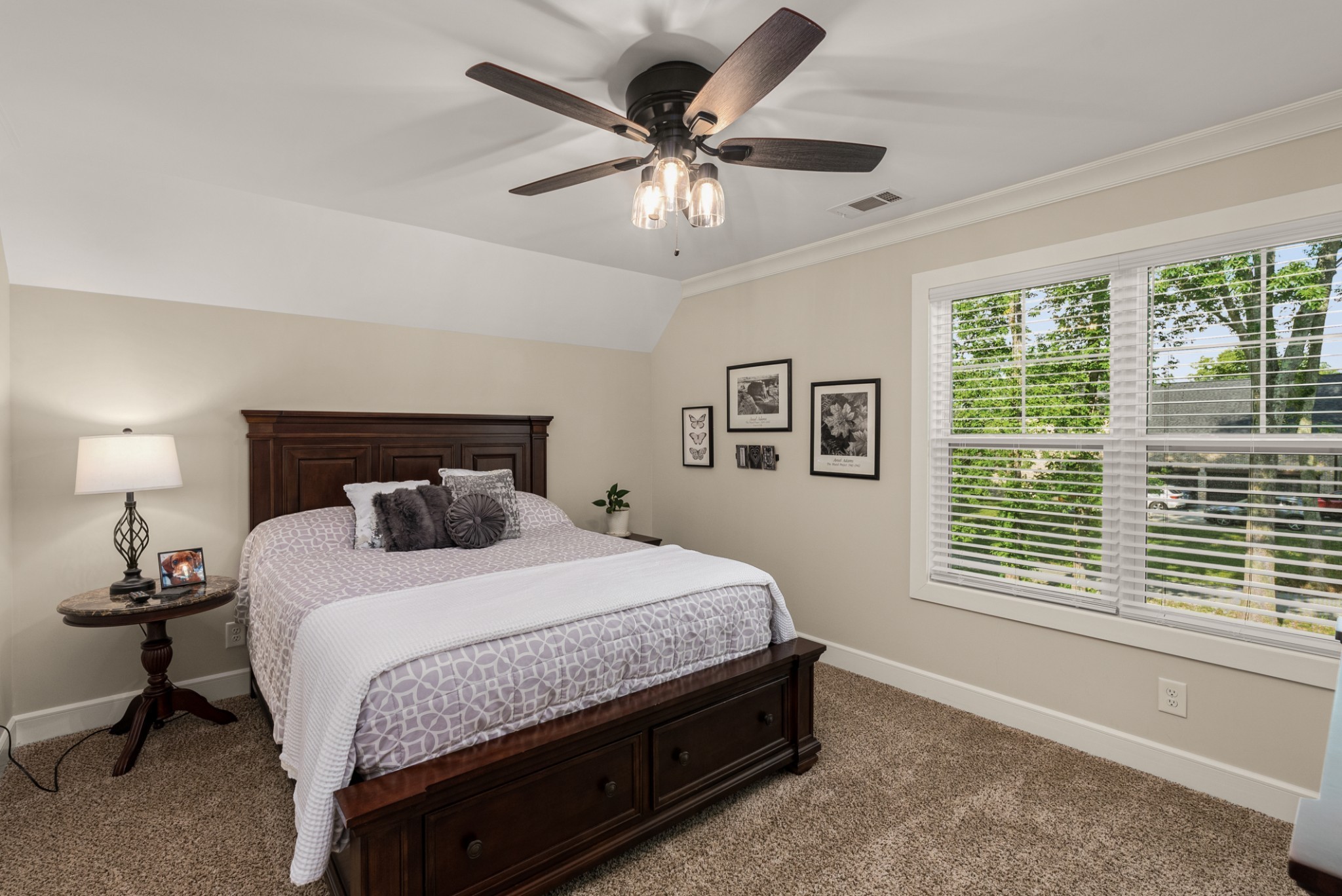 1497 Phillips Road Lebanon, TN 37087 - Photo 31 of 53 a bedroom with a bed and a table in it with a ceiling fan