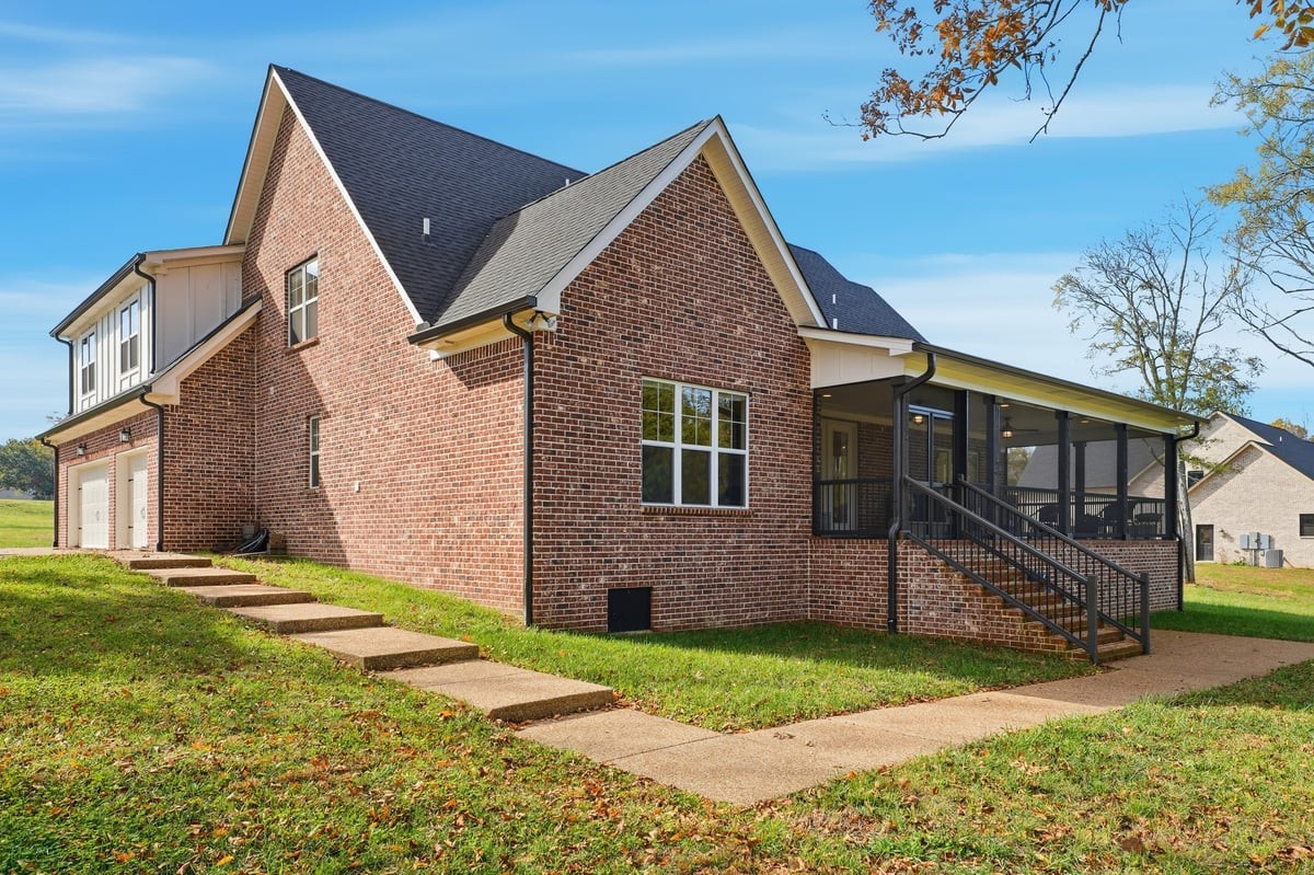 1497 Phillips Road Lebanon, TN 37087 - Photo 40 of 53 a view of a yard in front of a house with plants and large tree