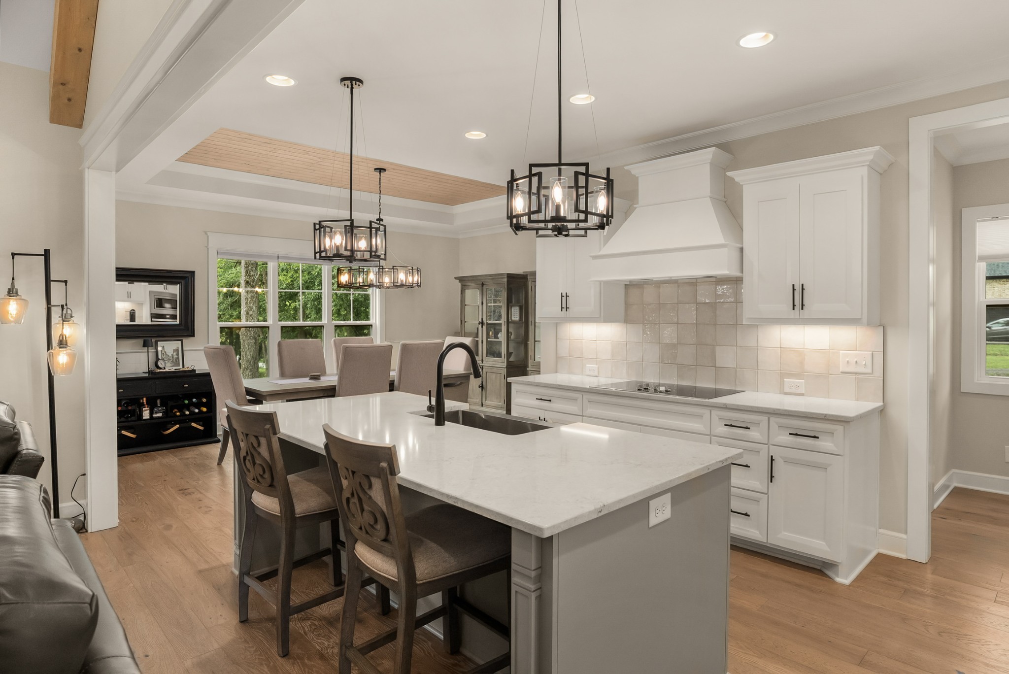 1497 Phillips Road Lebanon, TN 37087 - Photo 10 of 53 a kitchen with stainless steel appliances kitchen island granite countertop a table chairs in it and white cabinets