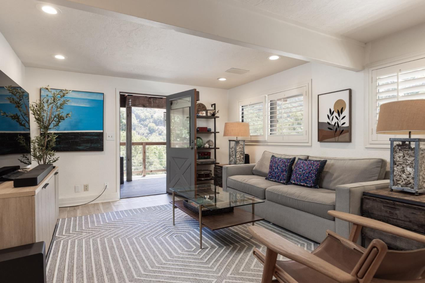 55 Paso Cresta Carmel Valley, CA 93924 - Photo 17 of 31 a living room with furniture and a flat screen tv