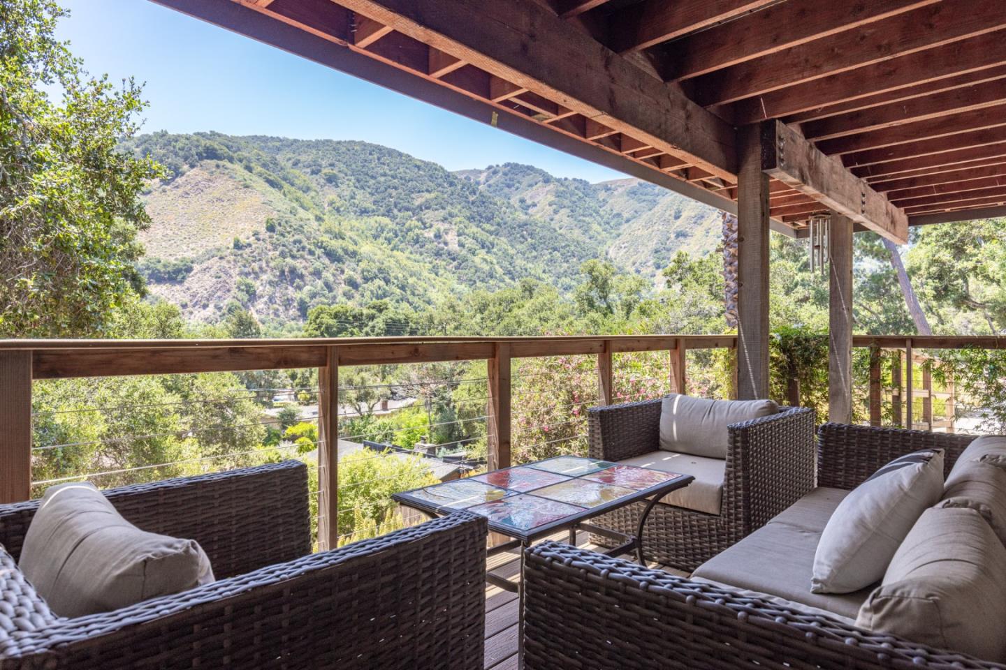 55 Paso Cresta Carmel Valley, CA 93924 - Photo 18 of 31 a living room with furniture and a floor to ceiling window