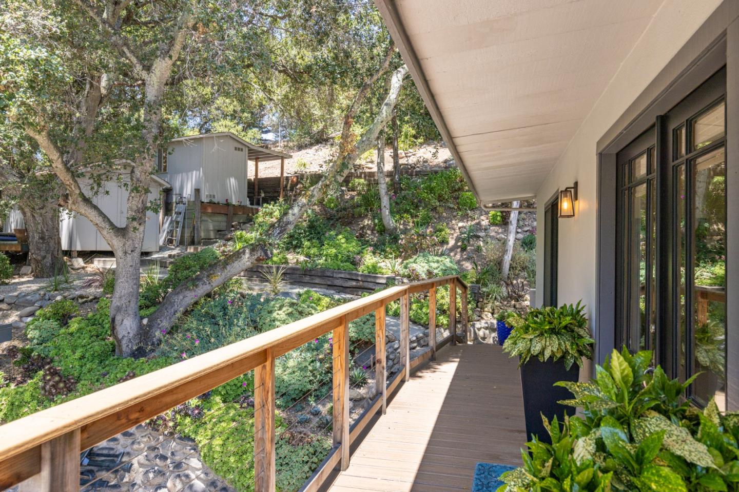55 Paso Cresta Carmel Valley, CA 93924 - Photo 24 of 31 a view of a house with a yard and balcony