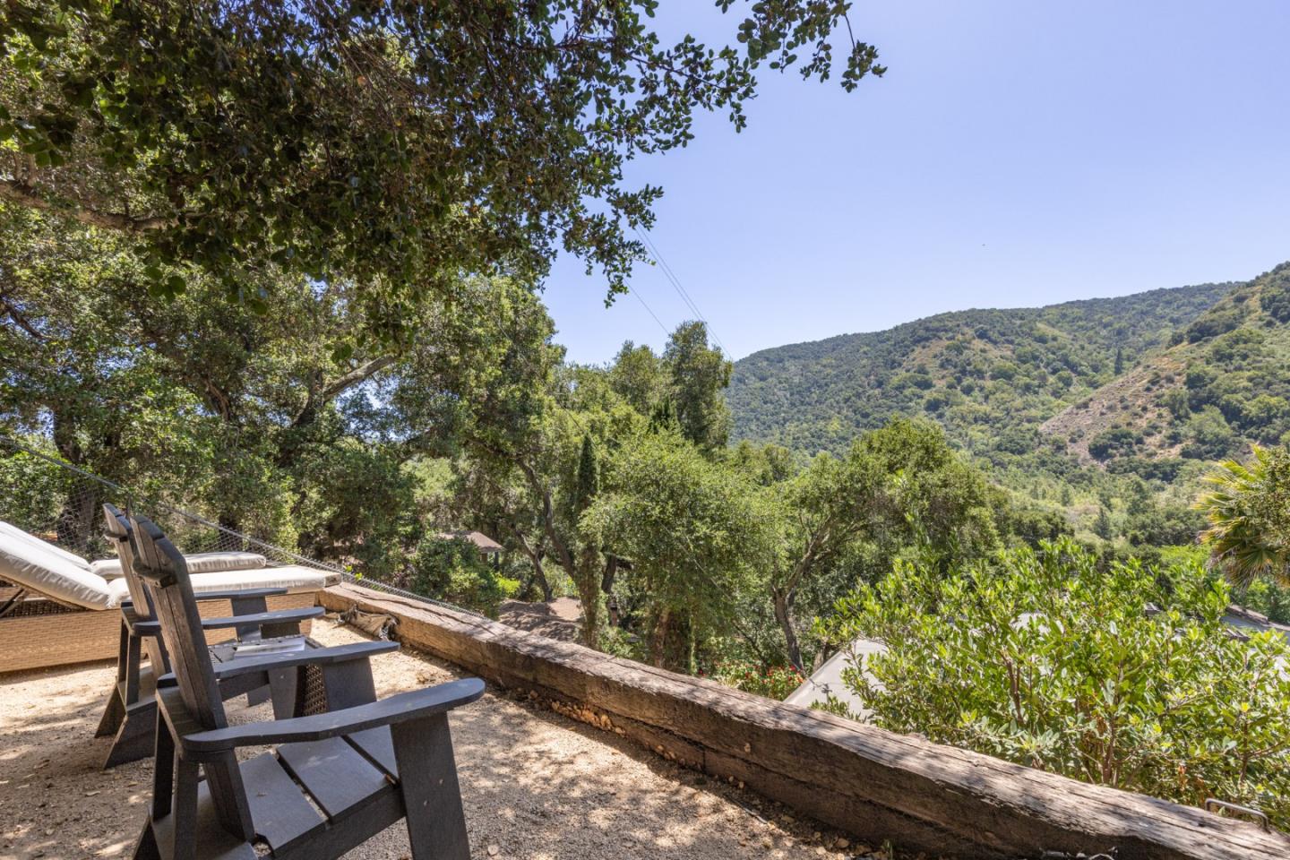 55 Paso Cresta Carmel Valley, CA 93924 - Photo 27 of 31 a balcony with wooden floor and outdoor seating