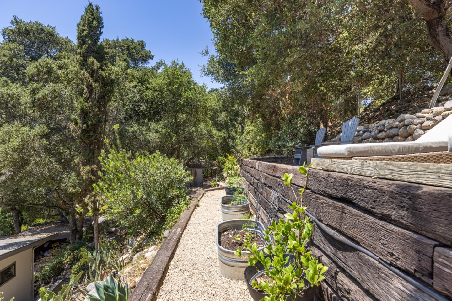 55 Paso Cresta Carmel Valley, CA 93924 - Photo 28 of 31 a view of a garden with chairs