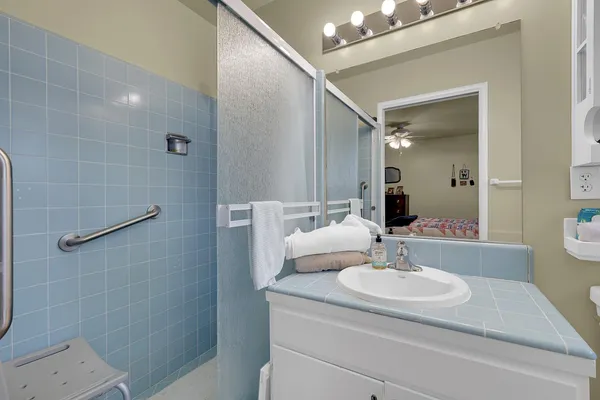a bathroom with a sink and a mirror
