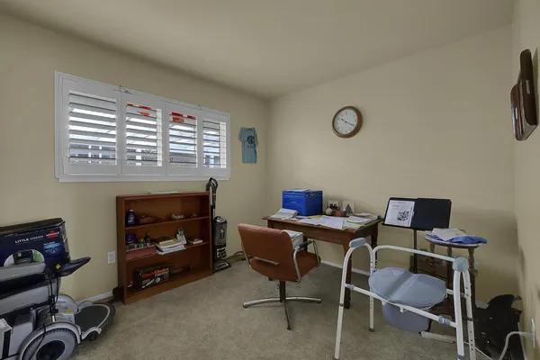 a view of a workspace with furniture
