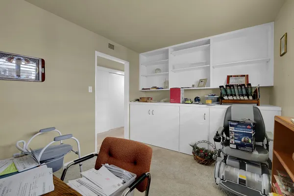 a room with furniture and a wooden floor