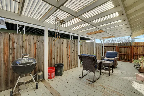 a view of a chairs and table in a patio