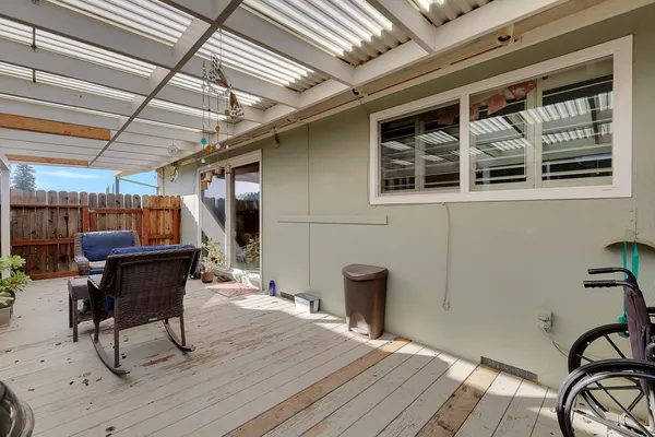 a view of a chairs and table in a patio