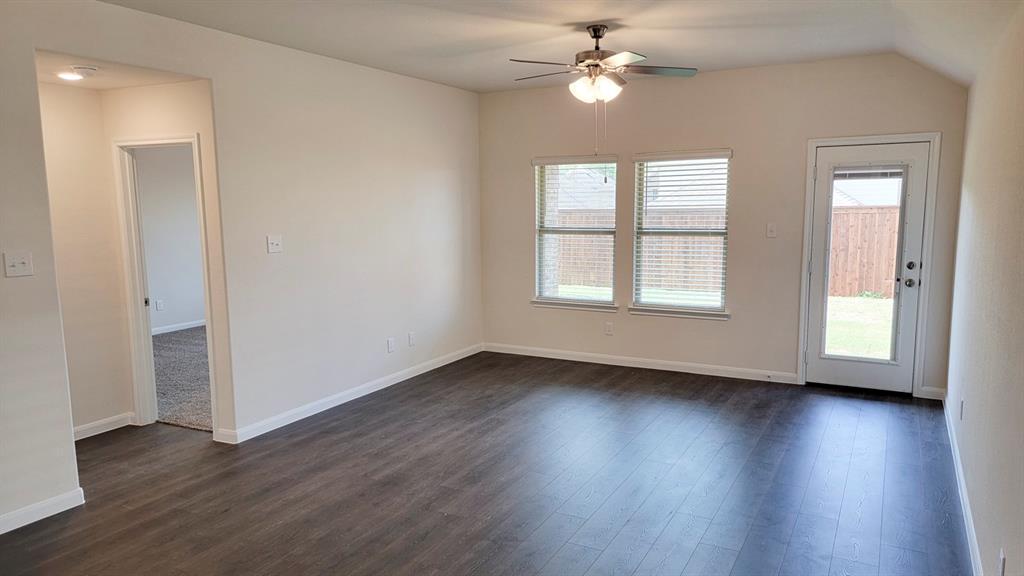 1807 Teton River Drive Blue Ridge, TX 75424 - Photo 9 of 12 a view of an empty room with wooden floor and a window