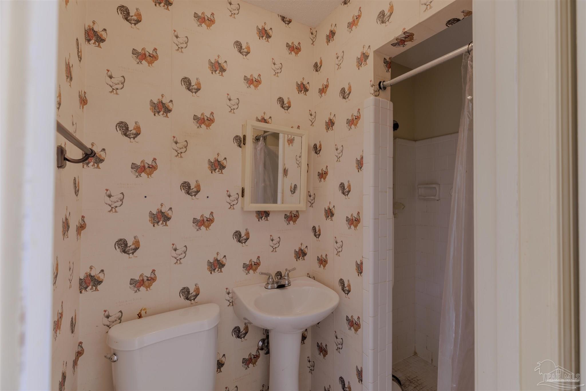 5700 Adelyn Road Pensacola, FL 32504 - Photo 16 of 33 a bathroom with a sink and toilet