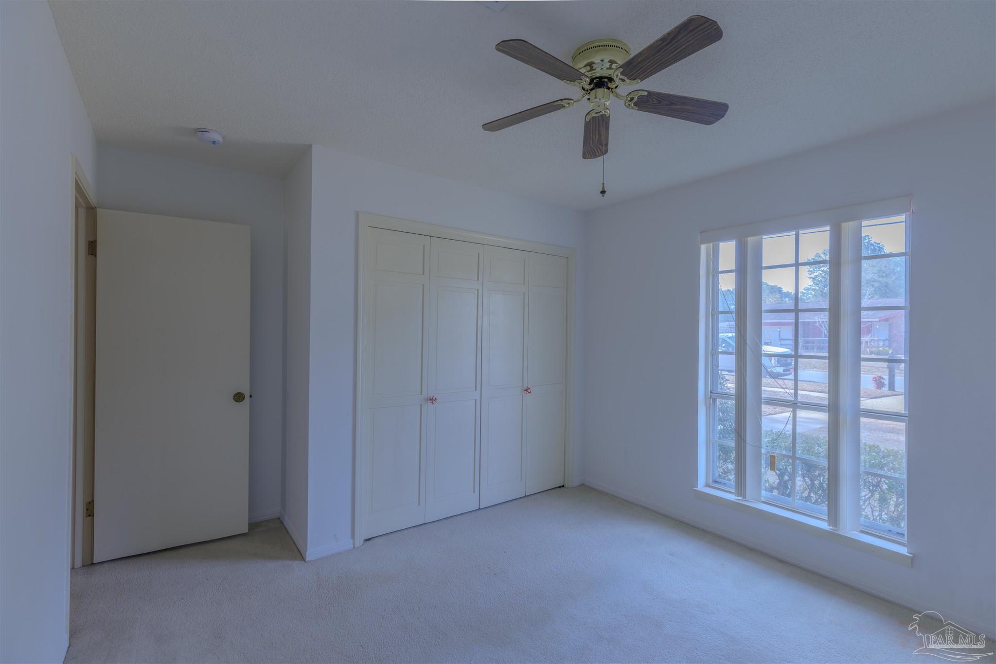 5700 Adelyn Road Pensacola, FL 32504 - Photo 21 of 33 a view of an empty room with a window