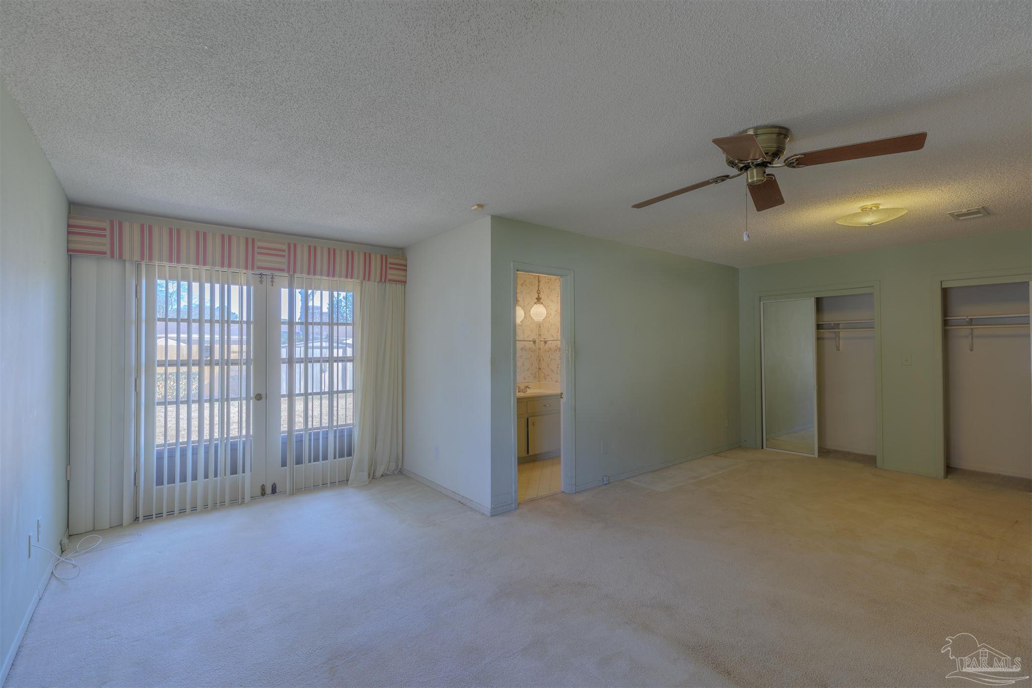 5700 Adelyn Road Pensacola, FL 32504 - Photo 23 of 33 an empty room with windows